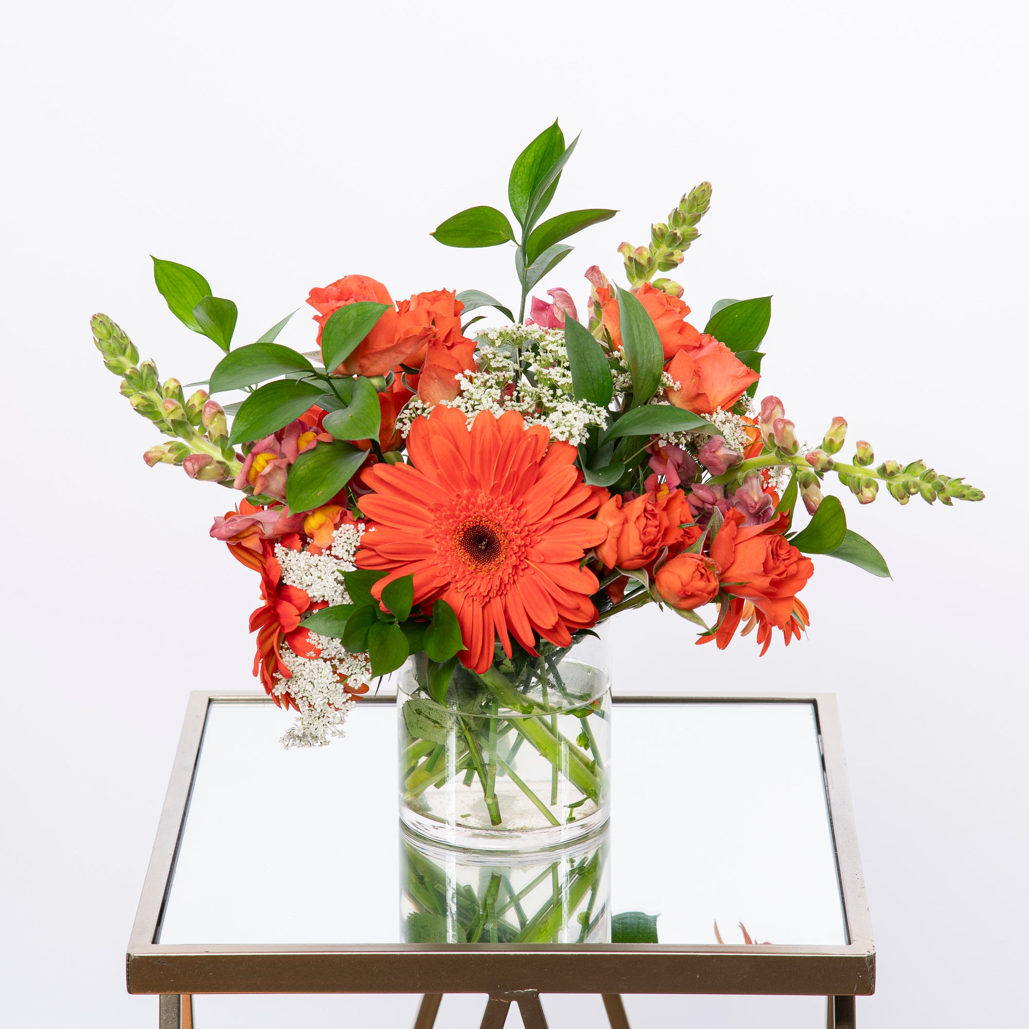 Fall trade show small arrangement with fall colored floral with vase. Atlanta flower delivery